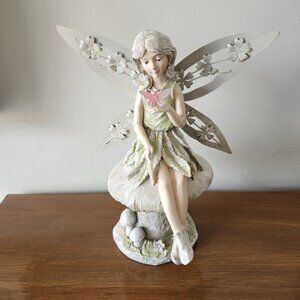 Garden Fairy with Metal Wings sitting on A Mushroom